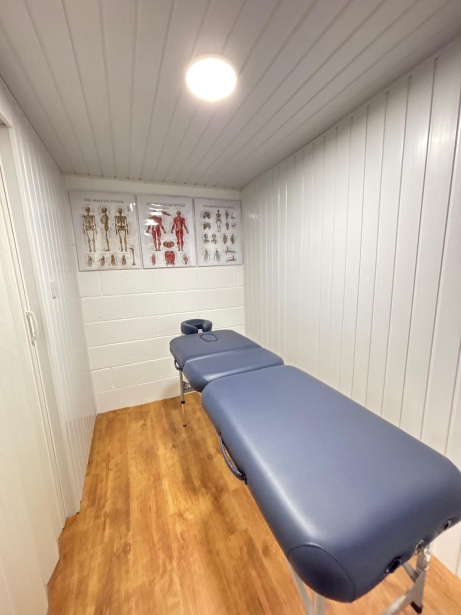 Treatment room containing massage bench